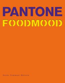 Purple and yellow font to top of orange cover of 'Pantone Foodmood', by Guido Tommasi Editore.