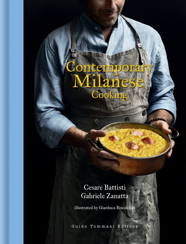 Chef in grey apron holding copper pan will yellow food, on cover of 'Contemporary Milanese Cooking', by Guido Tommasi Editore.