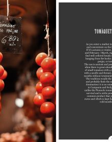 Book cover of The Boqueria, with Barcelona's La Boqueria food market, with large lights hanging from ceiling above crowds of shoppers and tourists. Published by Guido Tommasi Editore.