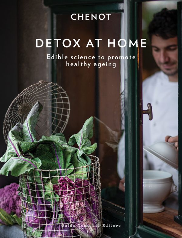 Book cover of Chenot 's Detox at Home, Edible science to promote healthy ageing, with a metal basket of swiss chard on window sill, man in chef whites behind window. Published by Guido Tommasi Editore.