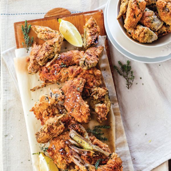 Book cover of From the Markets of Tuscany: A Collection of Traditional, Seasonal Recipes, with a pan of pasta and a bowl of butter beans. Published by Guido Tommasi Editore.