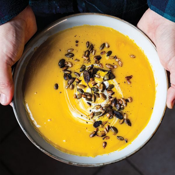 Book cover of From the Markets of Tuscany: A Collection of Traditional, Seasonal Recipes, with a pan of pasta and a bowl of butter beans. Published by Guido Tommasi Editore.
