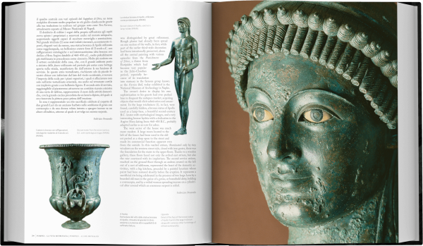 Book cover of Pompeii: A Life Revealed, featuring a bronze head with mouth open, and bright yellowing eyes. Published Scripta Maneant Editori.