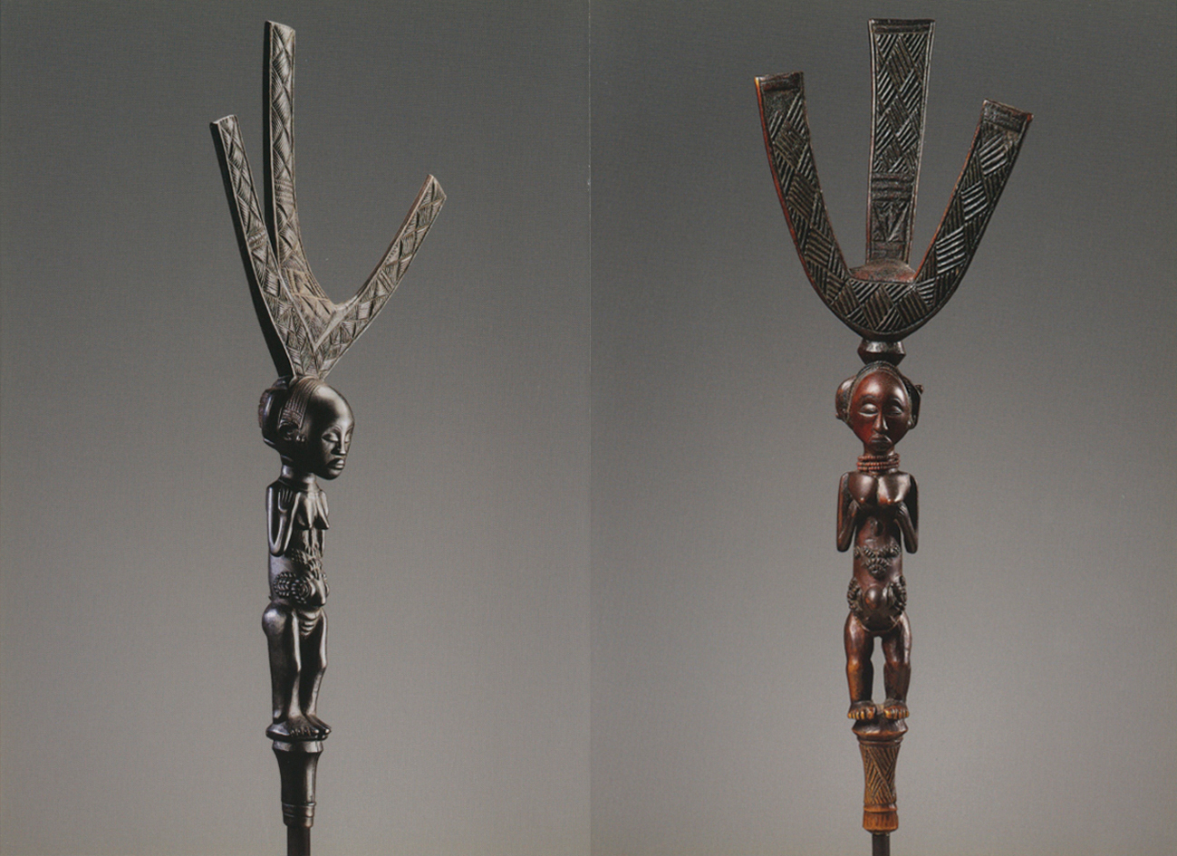 Dark wood carved mask with horn ears, black cover, VISIONS OF AFRICA LUBA in black font on top white banner.