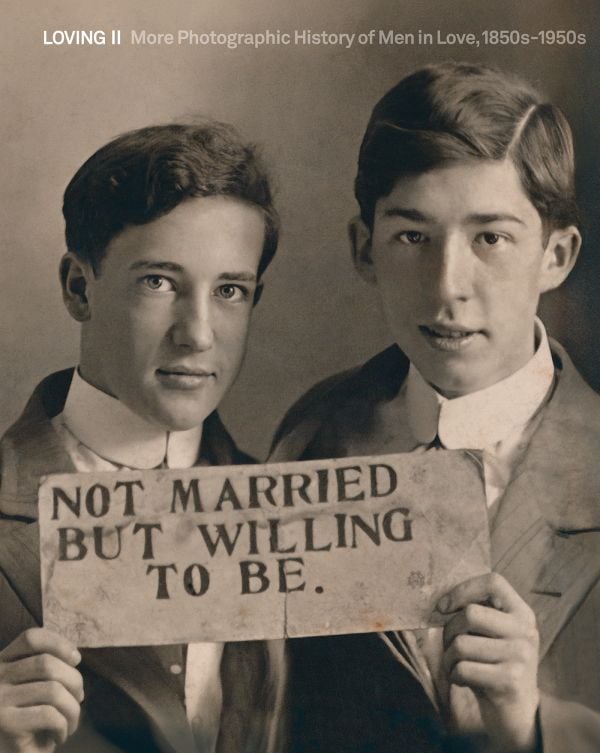 Book cover of Loving II: More photographic history of men in love, 1850s - 1950s; featuring a male couple holding up a sigh saying 'Not married but willing to be'. Published by 5 Continents Editions.