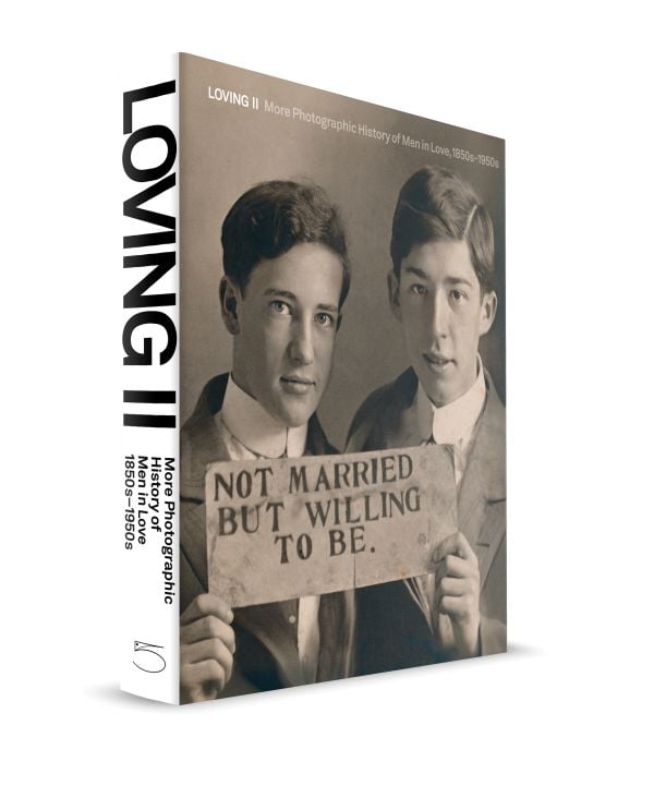 Book cover of Loving II: More photographic history of men in love, 1850s - 1950s; featuring a male couple holding up a sigh saying 'Not married but willing to be'. Published by 5 Continents Editions.