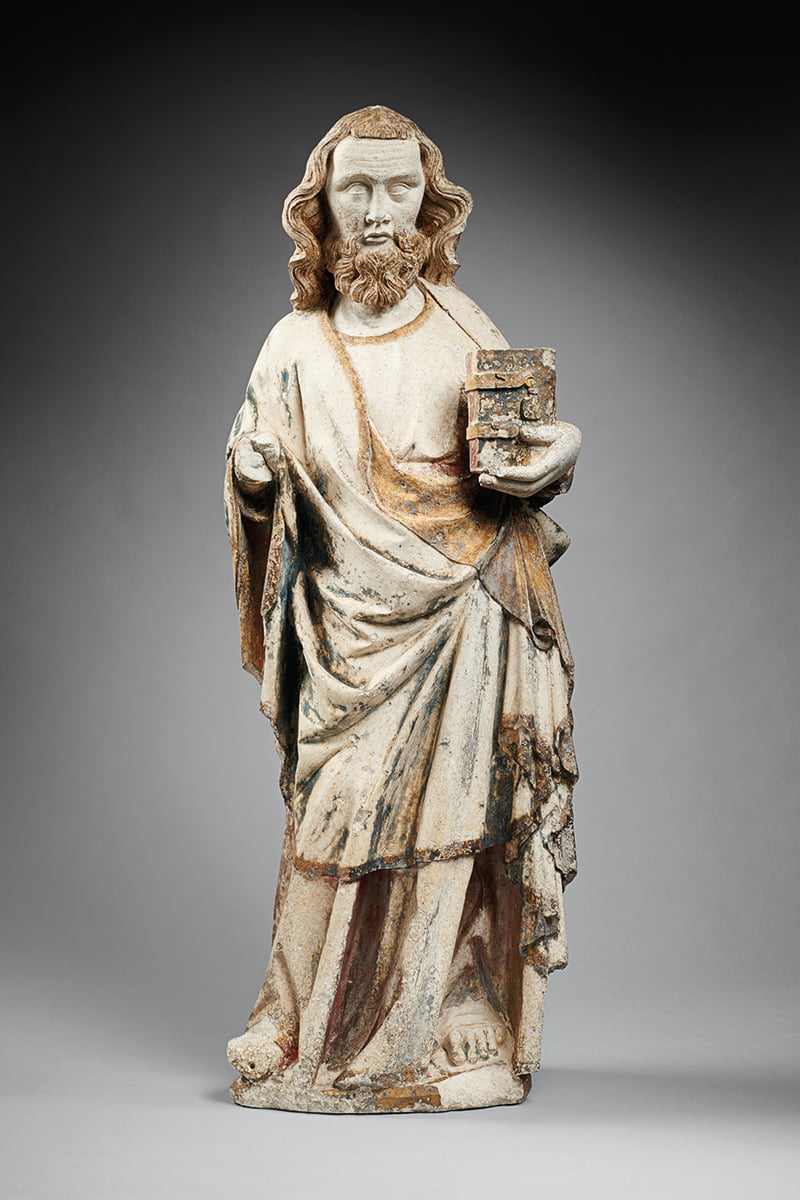 Cream statue of woman in large dress, holding book in right hand, on grey cover, THE DECORATIVE ARTS in white font on left grey border.