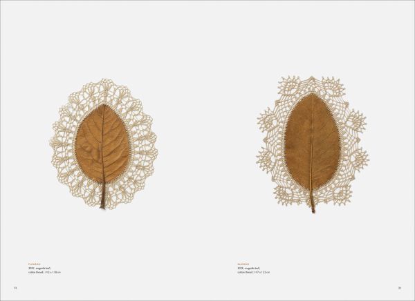 Book cover of art monograph Susanna Bauer, with brown leaf with white circle of beads embroidered to centre. Published by 5 Continents Editions.