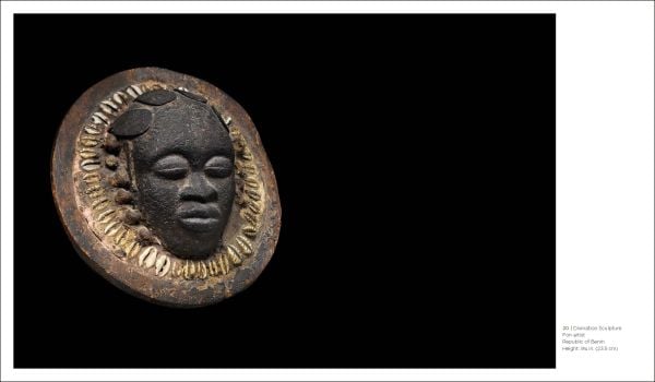 Pale grey book cover of Beauty Unusual, Masterworks from the Ceil Pulitzer Collection of African Art, featuring a dark brown African mask. Published by 5 Continents Editions.