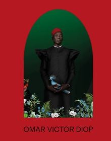 Red book cover of Omar Victor Diop, featuring a portrait photo of black man in black smock and red hat, holding blue exotic bird, titled 'Allegoria 1, 2021'. Published by 5 Continents Editions.