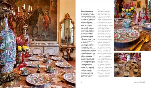 Book cover of Dining in Style: Between the Traditional and the Contemporary, featuring a classical dining table with crystal glasses and floral, porcelain plates. Published by Mandragora.
