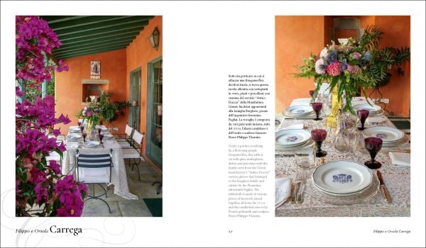 Book cover of Dining in Style: Between the Traditional and the Contemporary, featuring a classical dining table with crystal glasses and floral, porcelain plates. Published by Mandragora.