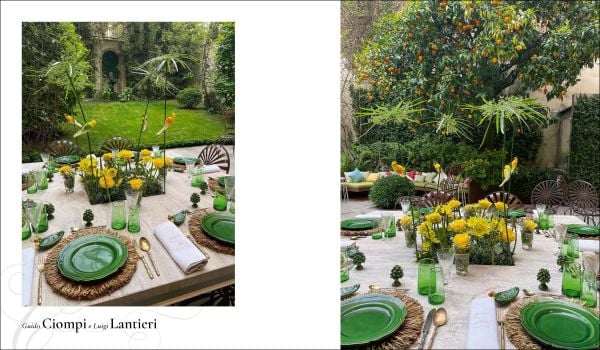 Book cover of Dining in Style: Between the Traditional and the Contemporary, featuring a classical dining table with crystal glasses and floral, porcelain plates. Published by Mandragora.