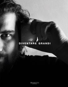 Book cover of Diventare Grandi: Becoming Grandi, with the chef holding a cup to his left ear. Published by Manfredi Edizioni.