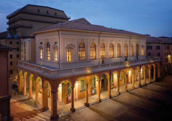 Grand interior of ceiling and seating area of Teatro Comunale di Bologna, Teatro Comunale di Bologna – The Comunale Theatre in Bologna in gold font above and below.
