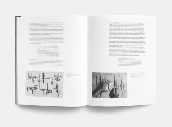 Metal sculpture, The Moon, the Sun, the Tower by Arnaldo Pomodoro, on brown cover of 'Arnaldo Pomodoro 1956-65', by Forma Edizioni.