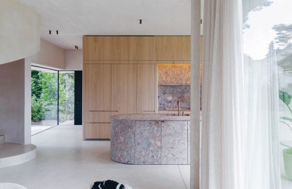 Book cover of Rocked: Architects, Designers & Artists, with shapes of pale stone. Published by Lannoo Publishers.