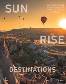Book cover of Sunrise Destinations; featuring a sunset landscape with hot air balloons rising in the distance. Published by Lannoo Publishers.