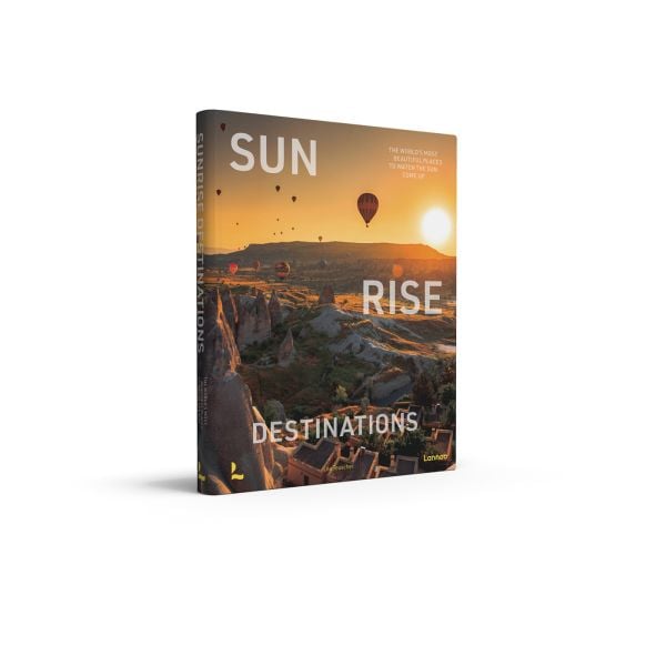 Book cover of Sunrise Destinations; featuring a sunset landscape with hot air balloons rising in the distance. Published by Lannoo Publishers.