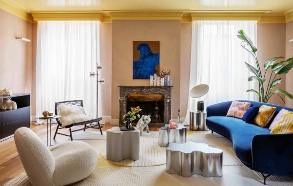 Book cover of All You Need is Colour: At Home; featuring a living room with floral rug, large mirror and tropical plant. Published by Lannoo Publishers.