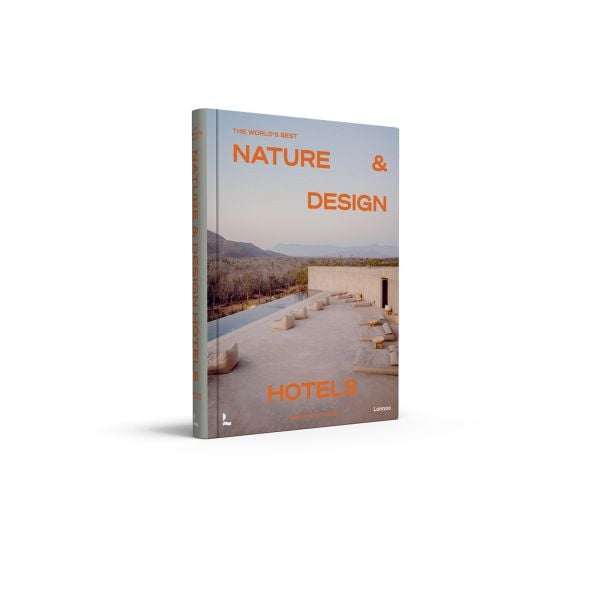 Book cover of The World’s Best Nature & Design Hotels; featuring a modern desert hotel with outdoor loungers. Published by Lannoo Publishers.