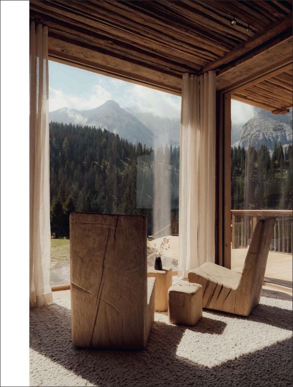 Book cover of The World’s Best Nature & Design Hotels; featuring a modern desert hotel with outdoor loungers. Published by Lannoo Publishers.