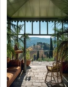 Book cover of The World’s Best Nature & Design Hotels; featuring a modern desert hotel with outdoor loungers. Published by Lannoo Publishers.