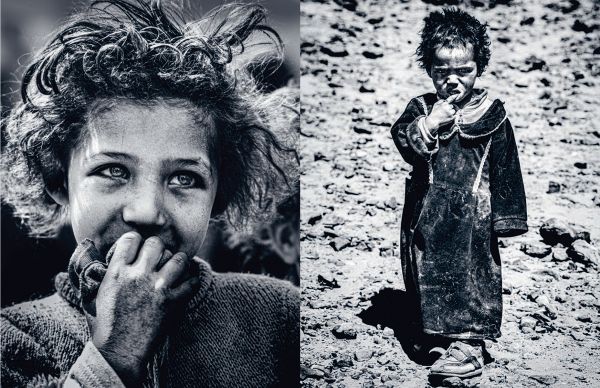 Book cover of Emotions: Portraits and Landscapes of the World; featuring a portrait of African girl smiling at camera. Published by Lannoo Publishers.
