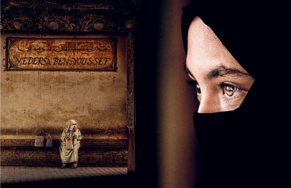 Book cover of Emotions: Portraits and Landscapes of the World; featuring a portrait of African girl smiling at camera. Published by Lannoo Publishers.