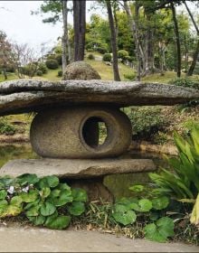 Book cover of Japandi Outdoor Living; featuring an outdoor patio area with swimming pool. Published by Lannoo Publishers.