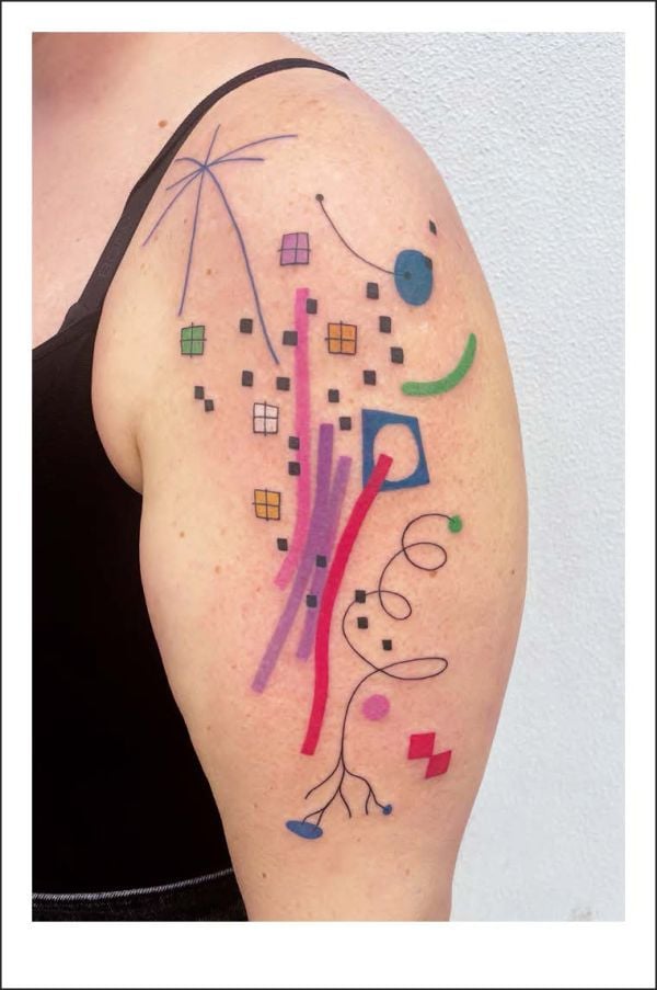 Book cover of Happy Tattoos: The Best Fun-Loving Tattoo Artists; featuring three tattoos: a dinosaur on a skateboard, a penguin with a bow on its head, and a dragon shouting through megaphone. Published by Lannoo Publishers.