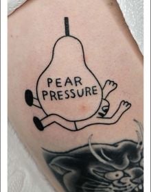 Book cover of Happy Tattoos: The Best Fun-Loving Tattoo Artists; featuring three tattoos: a dinosaur on a skateboard, a penguin with a bow on its head, and a dragon shouting through megaphone. Published by Lannoo Publishers.