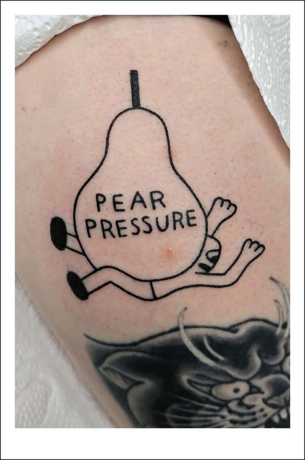 Book cover of Happy Tattoos: The Best Fun-Loving Tattoo Artists; featuring three tattoos: a dinosaur on a skateboard, a penguin with a bow on its head, and a dragon shouting through megaphone. Published by Lannoo Publishers.