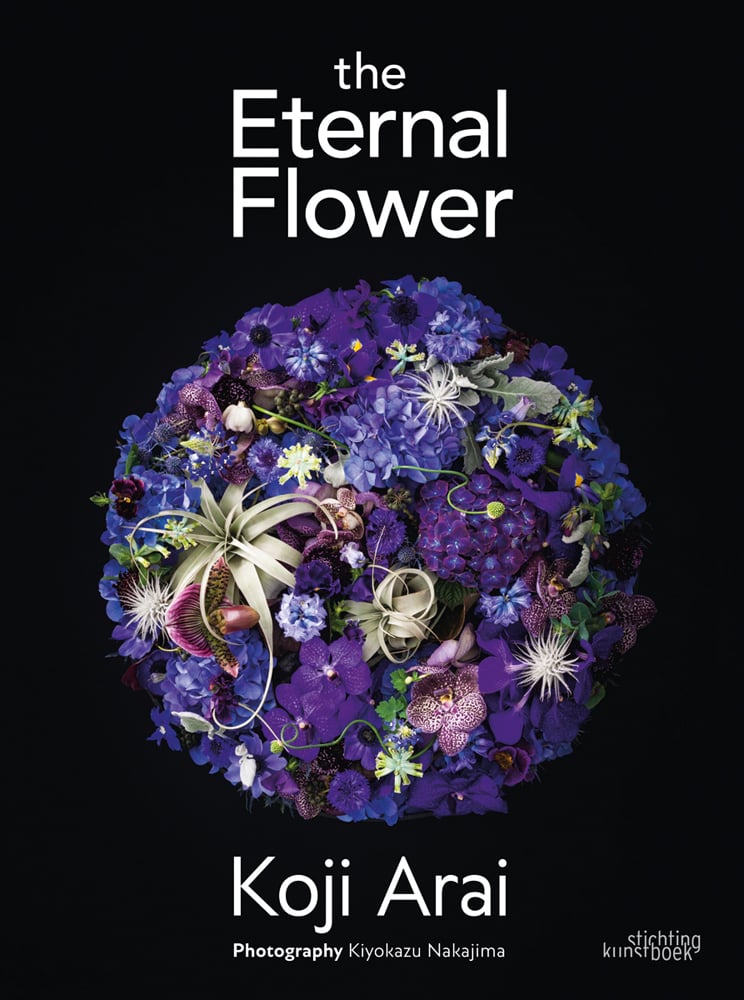 Black book cover of Koji Arai's The Eternal Flower, with a circular floral design of blue and purple flowers; clematis, hydrangea, orchid. Published by Stichting.