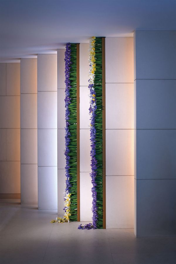 Book cover of Gary Kwok's Flowers and Design, with two glass holders filled with thin green stems topped with tiny bright blue flowers. Published by Stichting.