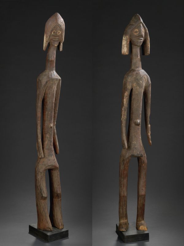 Black book cover of Jan Strybol's Art and the Sacred in Mumuyeland, featuring a carved wood head with large holes for eyes and blunt beak. Published by Stichting.