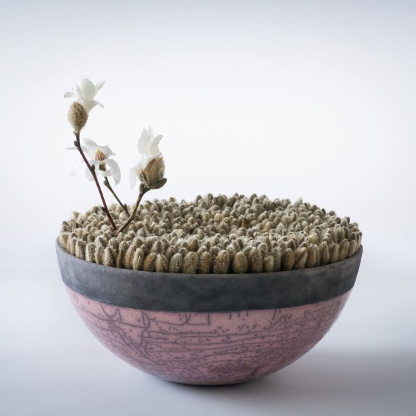 Black book cover of Hideyuki Niwa, Botanical Metamorphosis, with an aerial view of green lily pads surrounded by red roses. Published by Stichting.