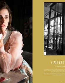 Book cover of photographer Henk van Cauwenbergh's Paris Revisited, featuring a female model in long black plunging dress, perched on stool in front on d'arc de triomphe. Published by Stichting.