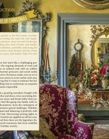 Book cover of Laura Dowling Designing Christmas: Practical Tips for Festive Decor, with an interior hallway with a large floral wreath on the door, Published by Stichting Kunstboek.