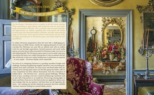 Book cover of Laura Dowling Designing Christmas: Practical Tips for Festive Decor, with an interior hallway with a large floral wreath on the door, Published by Stichting Kunstboek.