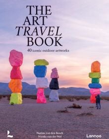 Book cover of The Art Travel Book: 40 Iconic Outdoor Artworks; featuring an outdoor art installation of large coloured rocks stacked on top of each other. Published by Lannoo Publishers.