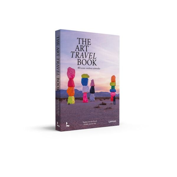 Book cover of The Art Travel Book: 40 Iconic Outdoor Artworks; featuring an outdoor art installation of large coloured rocks stacked on top of each other. Published by Lannoo Publishers.