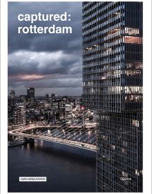 Book cover of Captured: Rotterdam; featuring an aerial view of the city at night. Published by Lannoo Publishers.