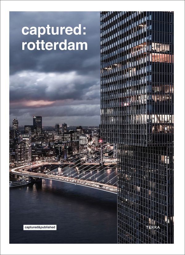 Book cover of Captured: Rotterdam; featuring an aerial view of the city at night. Published by Lannoo Publishers.