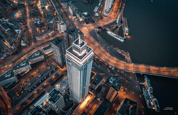 Book cover of Captured: Rotterdam; featuring an aerial view of the city at night. Published by Lannoo Publishers.