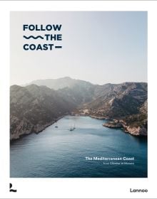 Book cover of Follow the Coast – from Gibraltar to Monaco: The Mediterranean Coast; featuring a scenic coastal view of rugged cliffs and calm waters. Published by Lannoo Publishers.