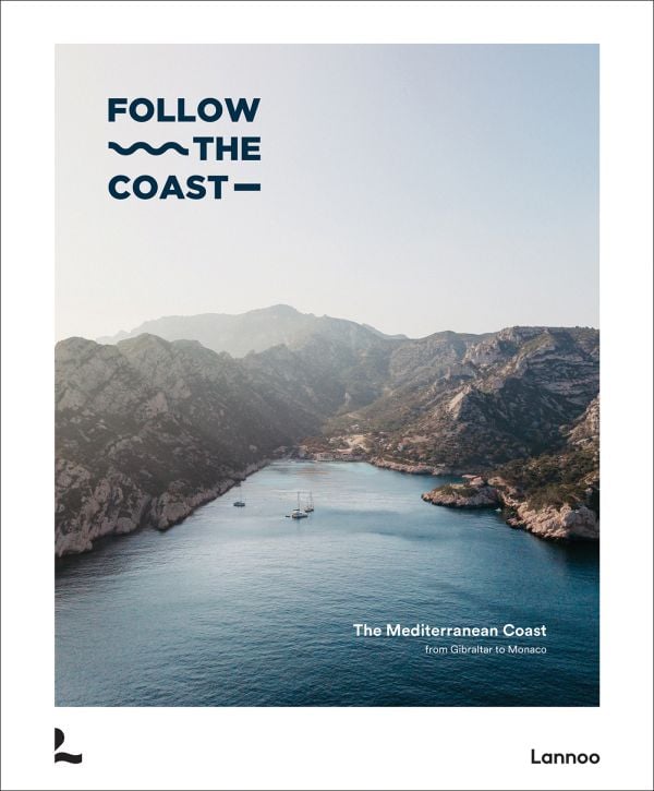 Book cover of Follow the Coast – from Gibraltar to Monaco: The Mediterranean Coast; featuring a scenic coastal view of rugged cliffs and calm waters. Published by Lannoo Publishers.