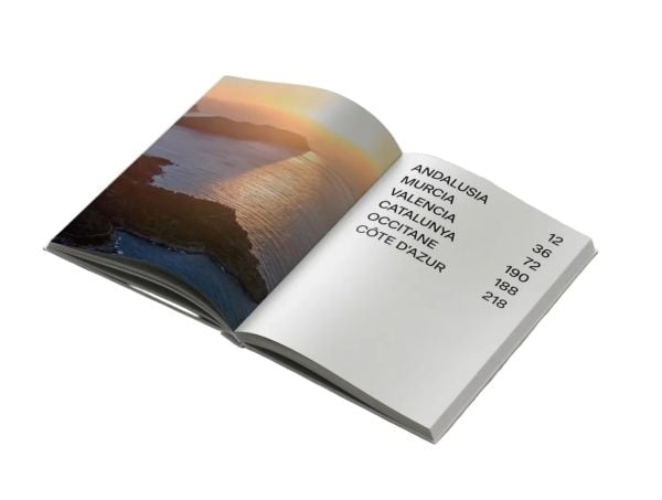 Book cover of Follow the Coast – from Gibraltar to Monaco: The Mediterranean Coast; featuring a scenic coastal view of rugged cliffs and calm waters. Published by Lannoo Publishers.