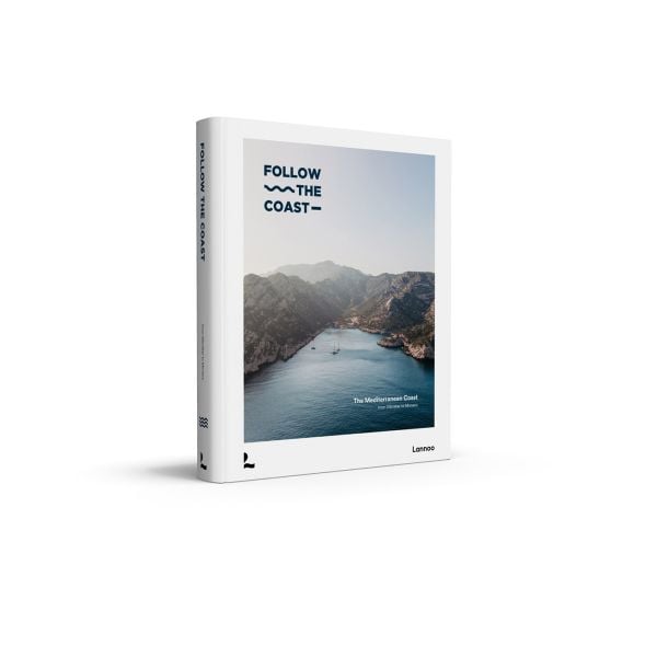 Book cover of Follow the Coast – from Gibraltar to Monaco: The Mediterranean Coast; featuring a scenic coastal view of rugged cliffs and calm waters. Published by Lannoo Publishers.
