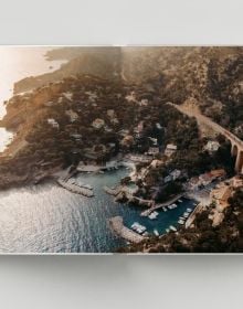 Book cover of Follow the Coast – from Gibraltar to Monaco: The Mediterranean Coast; featuring a scenic coastal view of rugged cliffs and calm waters. Published by Lannoo Publishers.